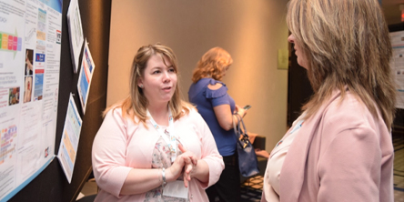 Image of 2 RNAO members speaking with each other