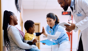 Nurse and doctor with mother and infant son