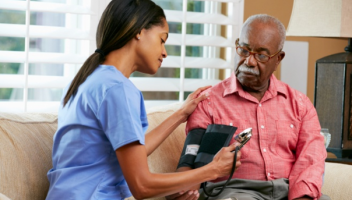 nurse and man taking blood pressure