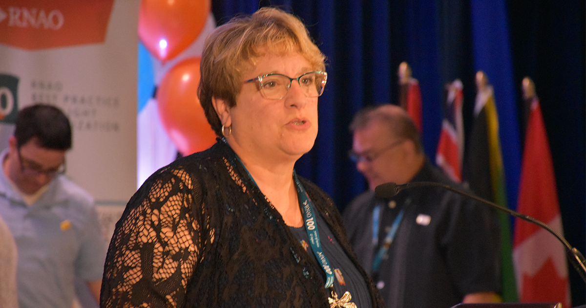 Sue LeBeau steps to the podium after accepting her new role as incoming president-elect. 