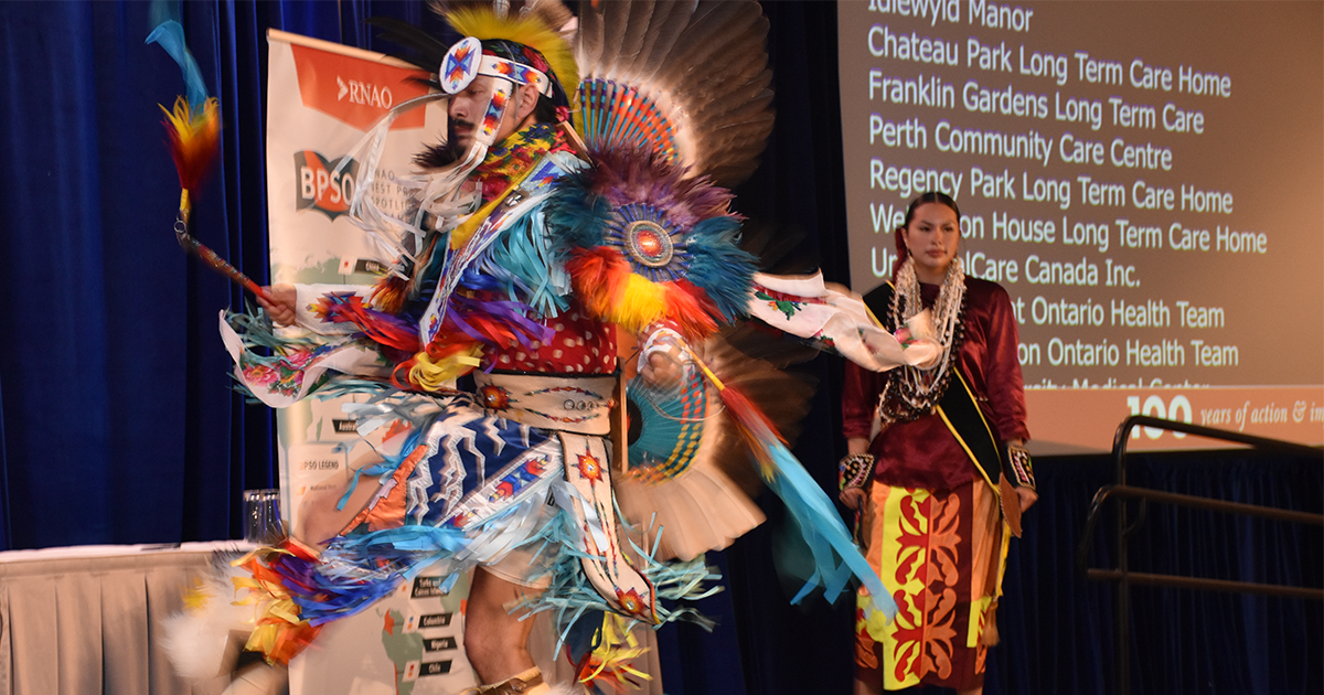 The Red Sky Performance Group performs an Indigenous dance to engage the crowd. 