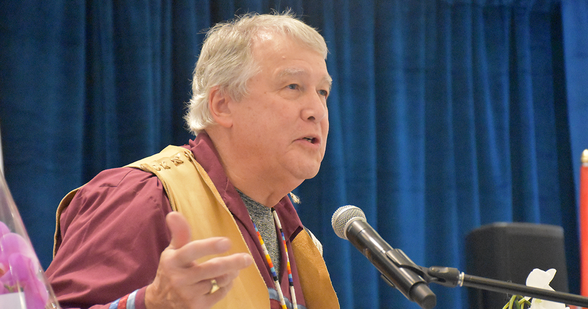 RNAO board Public Representative and Knowledge Keeper Dr. Tecumseh (Ed) Connors speaks at the podium at the 101st RNAO AGM on May 29, 2026.  