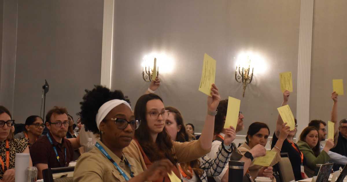 RNAO members raise their yellow cards to vote during the 101st AGM resolution consultation session on May 29, 2026.  