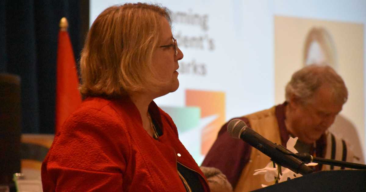 RNAO President Sue LeBeau (left) at the podium at RNAO’s 101st AGM May 29, 2026, flanked by Public Representative and Knowledge Keeper Dr. Tecumseh (Ed) Connors.  