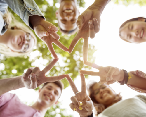 diverse group of people making a star